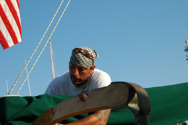 Aaron Tierno stows the main sail